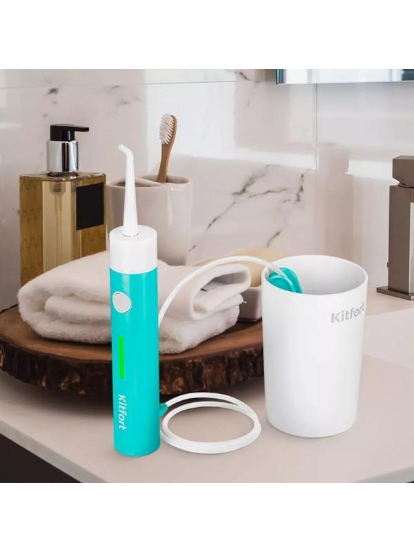 Ирригатор Kitfort КТ-2957-3, портативный, 320 мл, 3 режима, 2 насадки, от АКБ, бело-голубой