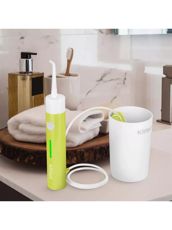 Ирригатор Kitfort КТ-2957-2, портативный, 320 мл, 3 режима, 2 насадки, от АКБ, бело-жёлтый