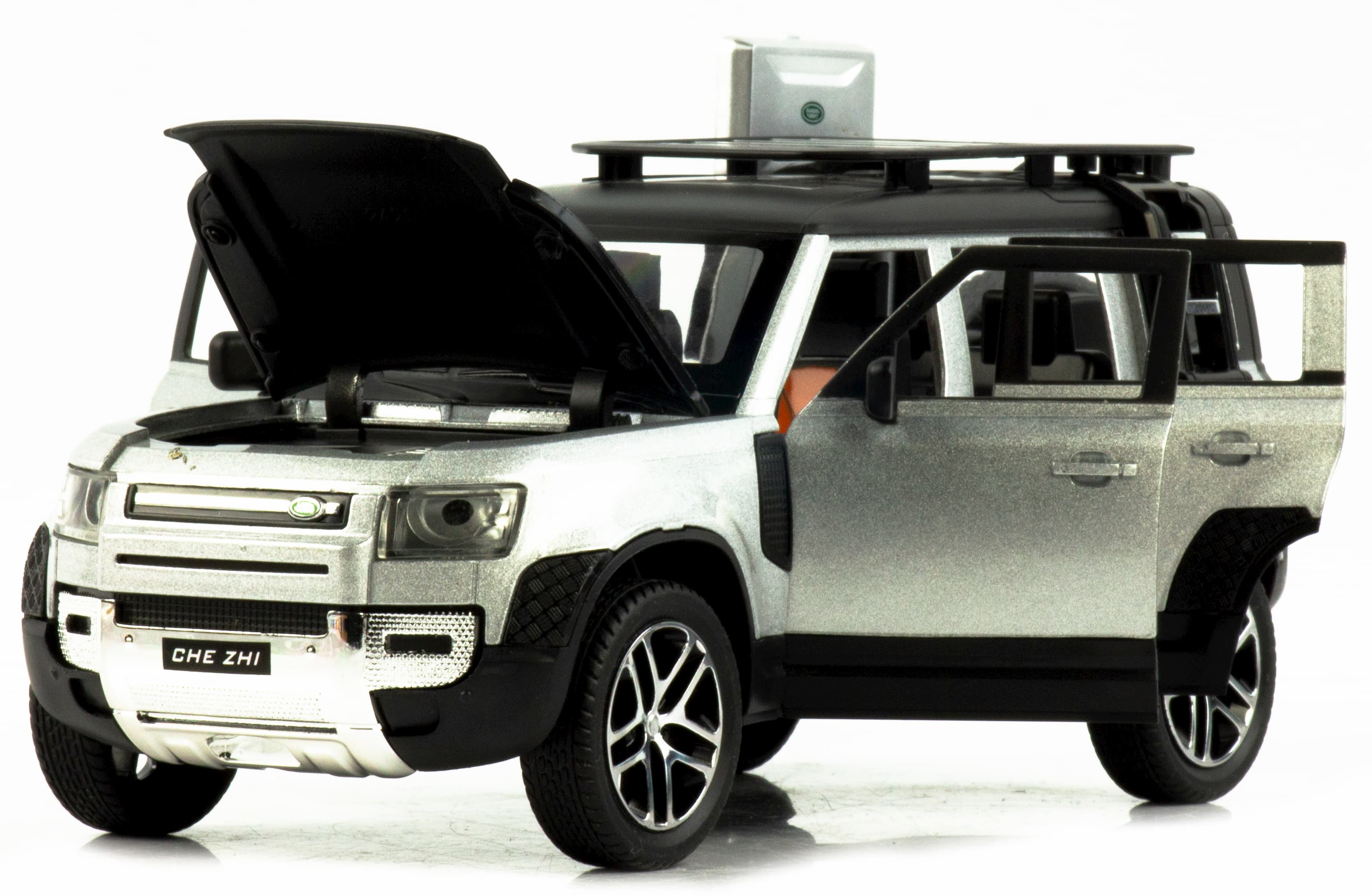 Металлическая машинка Che Zhi 1:24 «Land Rover Defender Wilderness» CZ132A, 21 см., инерционная, свет, звук / Серебристый