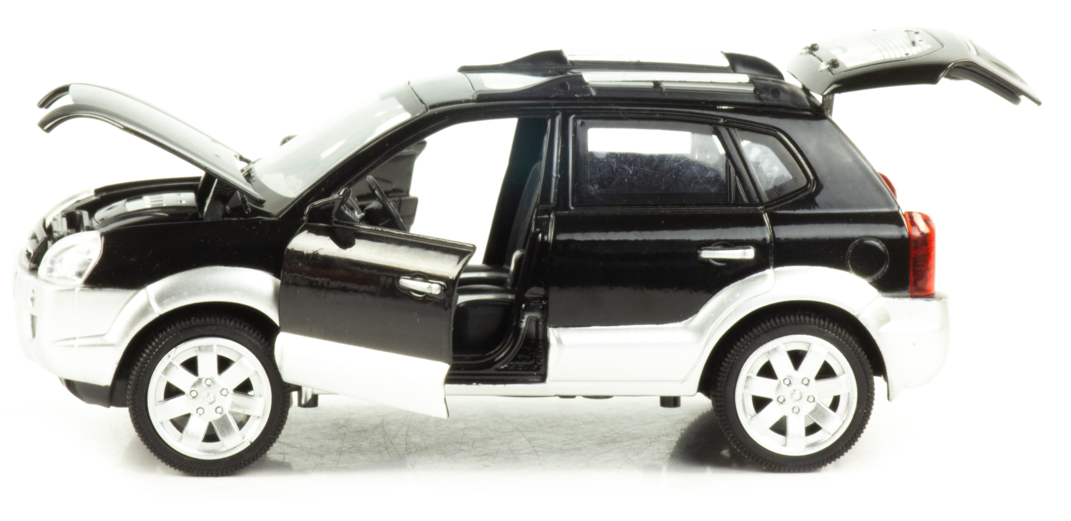 Металлическая машинка Wanbao 1:24 «Hyundai Tucson» 18 см. 892D инерционная, свет, звук / Черный