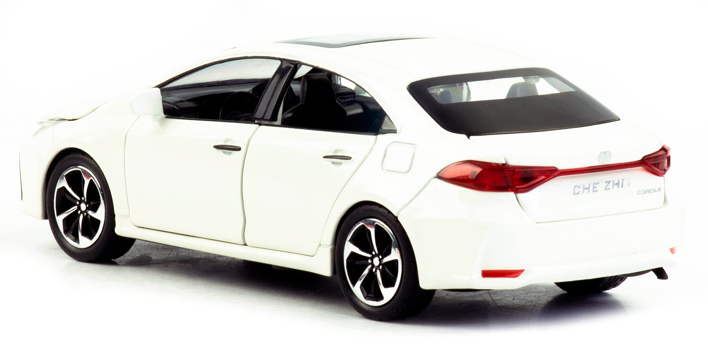 Металлическая машинка Che Zhi 1:32 «Toyota Corolla» CZ40A 15.2 см. инерционная, свет, звук / Белый