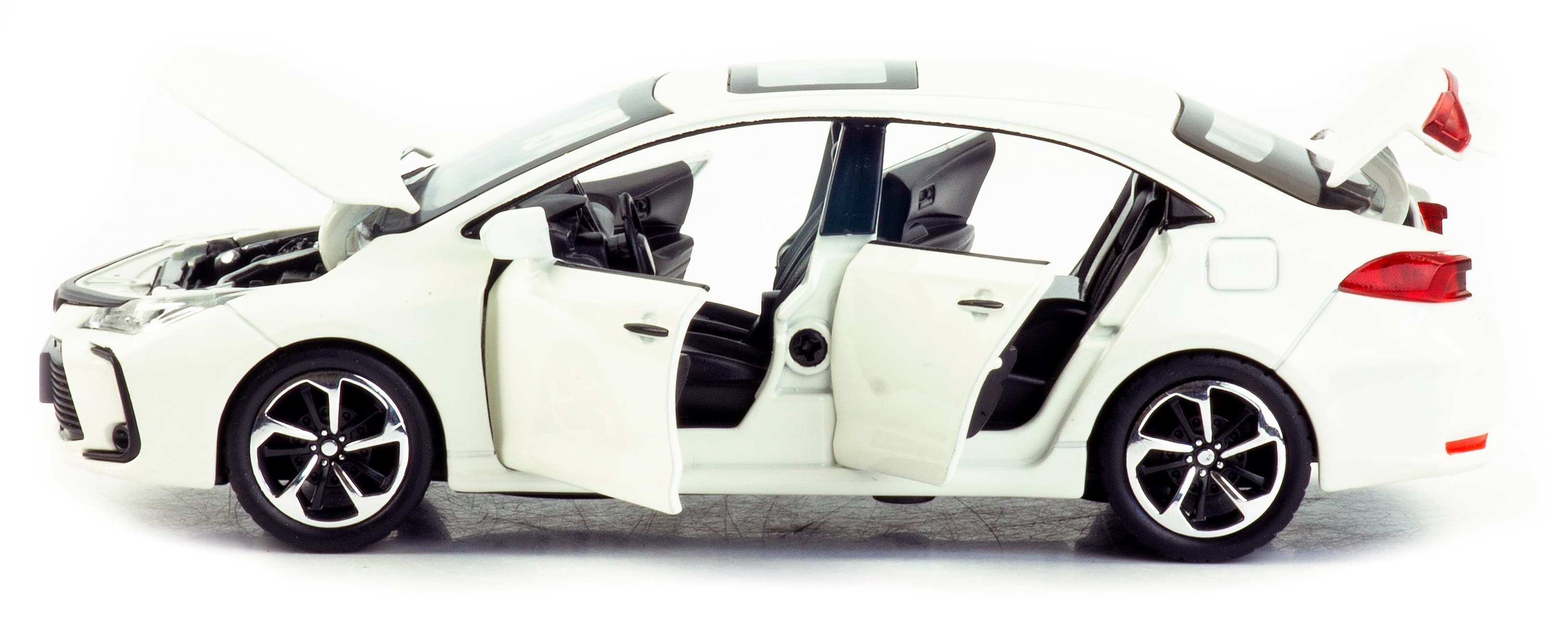 Металлическая машинка Che Zhi 1:32 «Toyota Corolla» CZ40A 15.2 см. инерционная, свет, звук / Белый