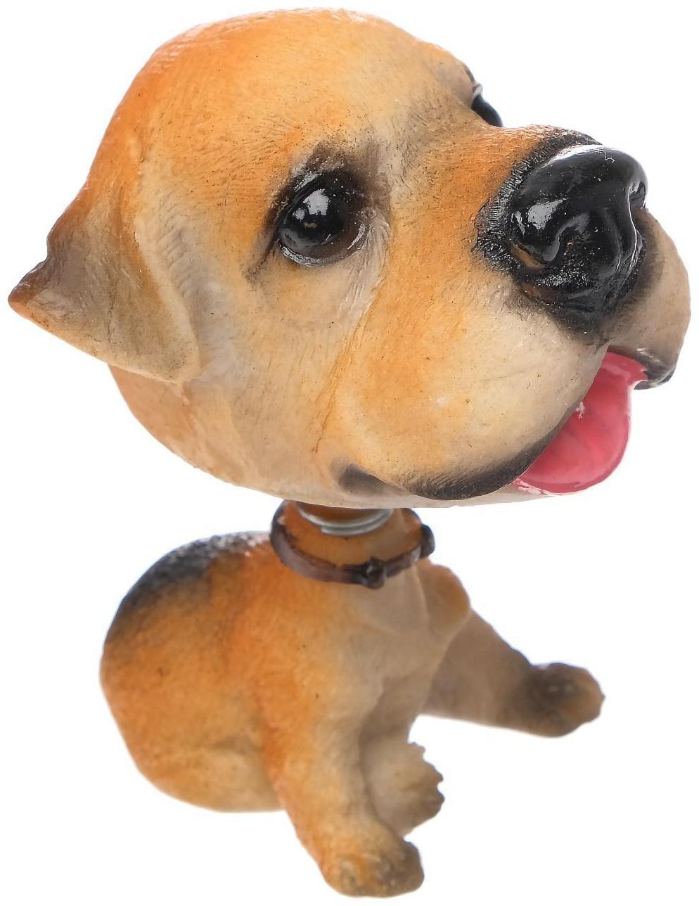 Собака на панель авто, качающая головой, уэльский терьер